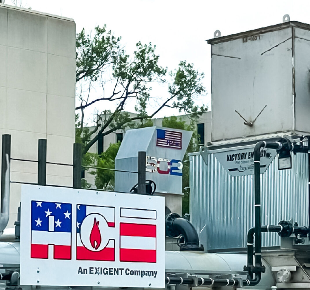 Mechanical equipment at Walter Reed Army Medical Center featuring ACE and Exigent Company branding, with visible ductwork and Victory Energy system components.